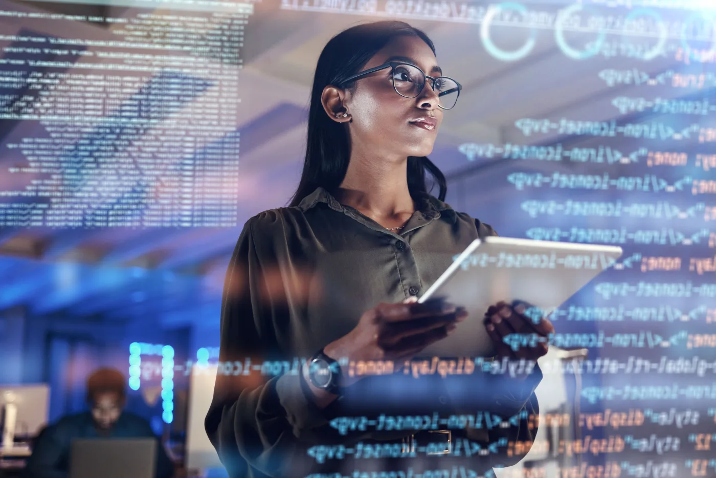 A developer reviewing code on a tablet, surrounded by glowing lines of software